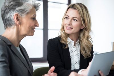 Work-conversation-older-woman-younger-woman