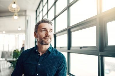 Man-looking-out-of-window