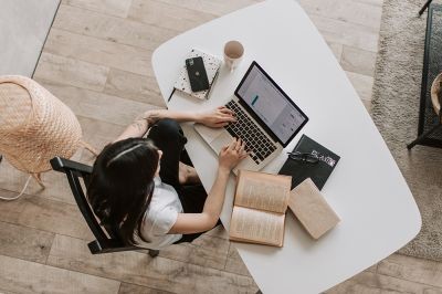 View-above-woman-focusing-at-desk