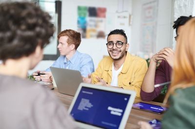 Happy-office-man-around-team